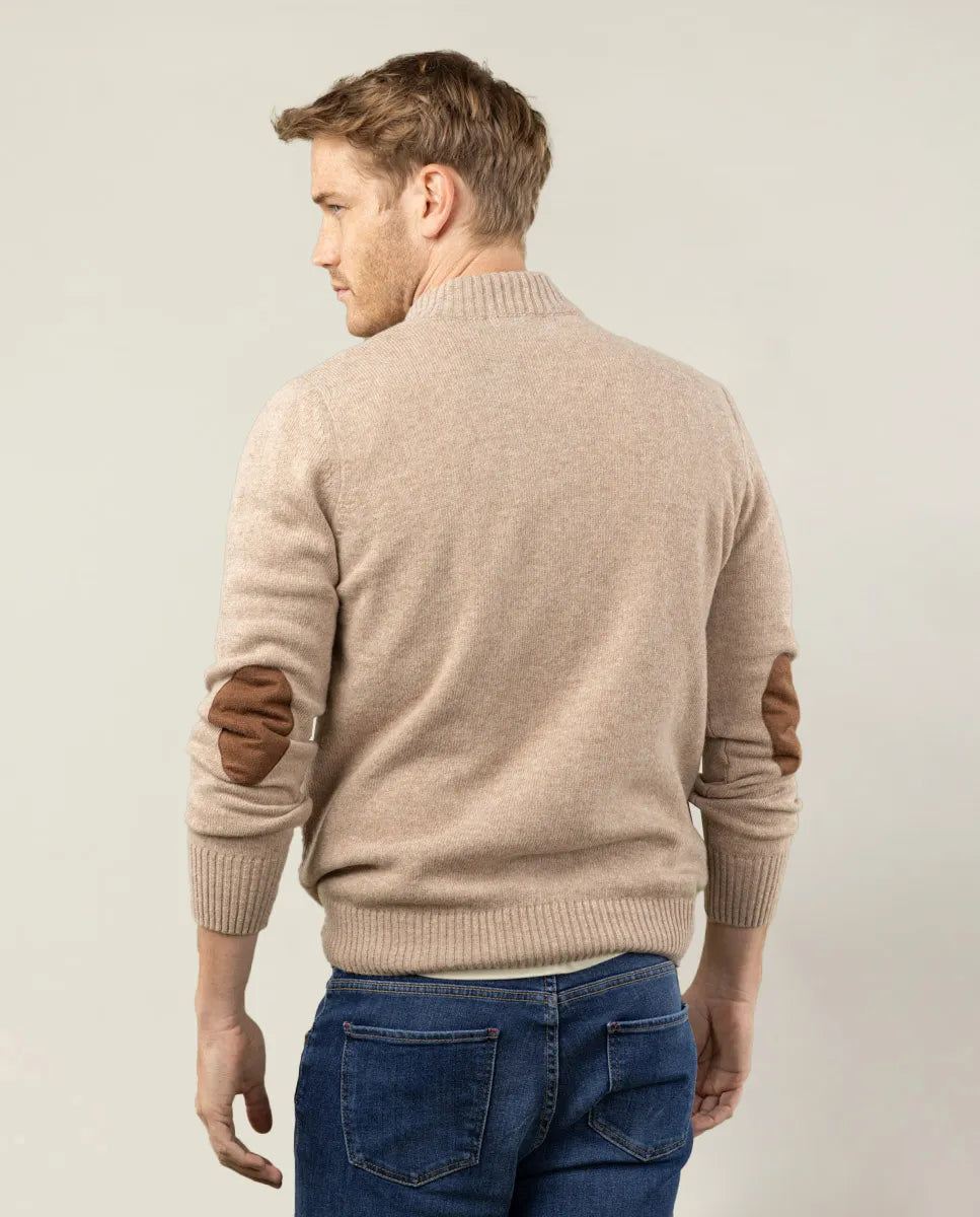 Jersey cuello con cierre cremallera en beige.