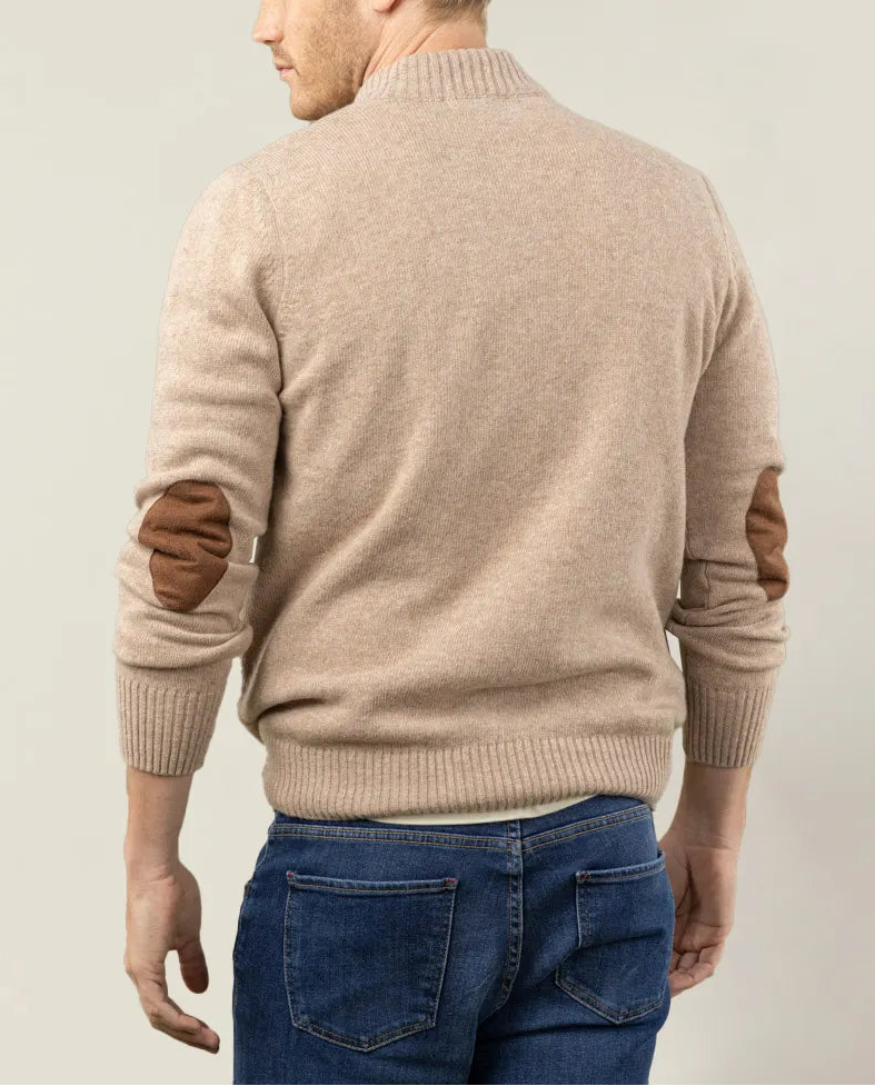Jersey cuello con cierre cremallera en beige.