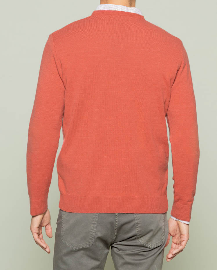 Suéter vermelho icônico com decote em V